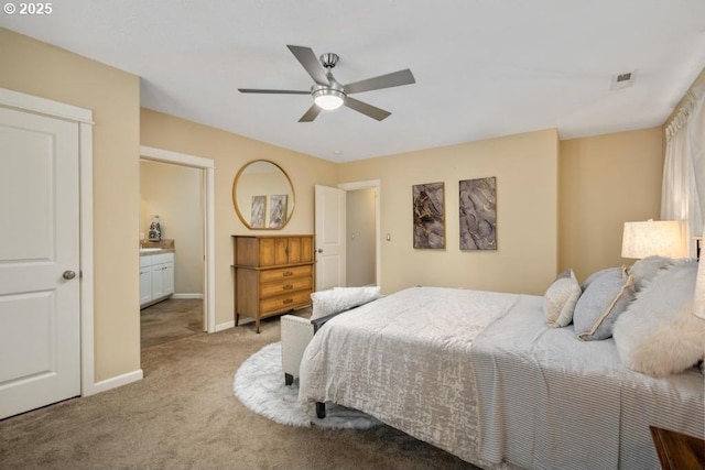 bedroom featuring light colored carpet, baseboards, and ceiling fan