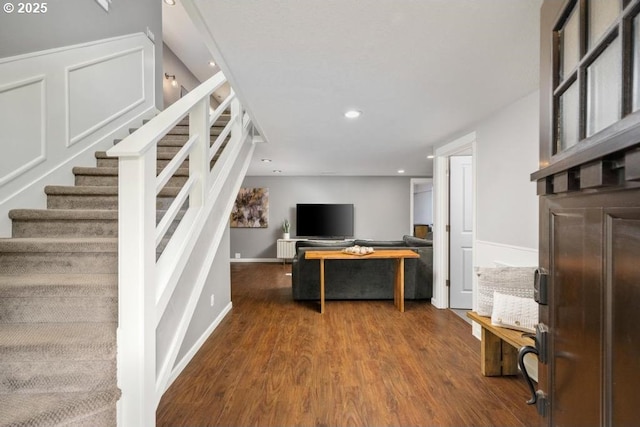 stairs featuring recessed lighting, wood finished floors, and baseboards