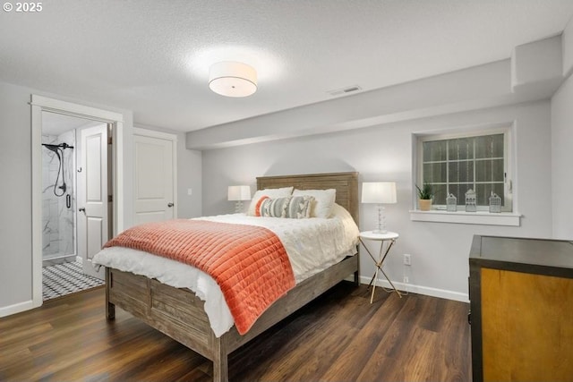 bedroom featuring wood finished floors, baseboards, connected bathroom, and a textured ceiling