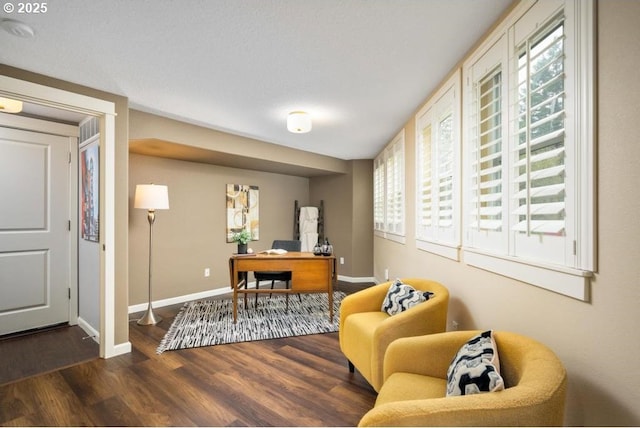 office area featuring dark wood-style floors and baseboards