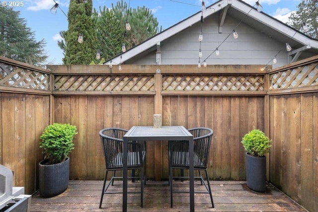 view of patio / terrace with fence and a deck