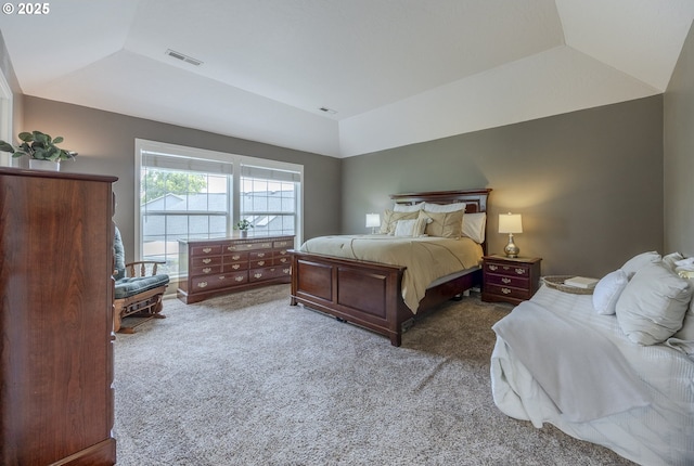 carpeted bedroom featuring vaulted ceiling