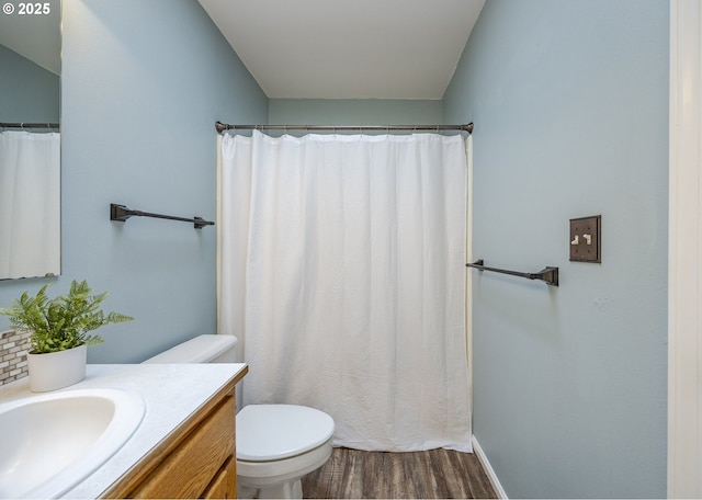 full bath featuring wood finished floors, vanity, toilet, and baseboards