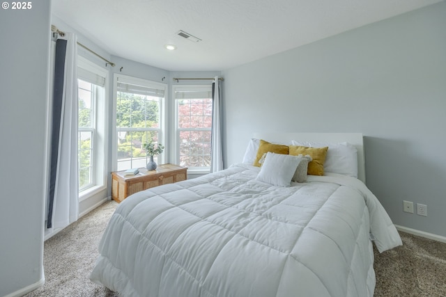 carpeted bedroom with baseboards