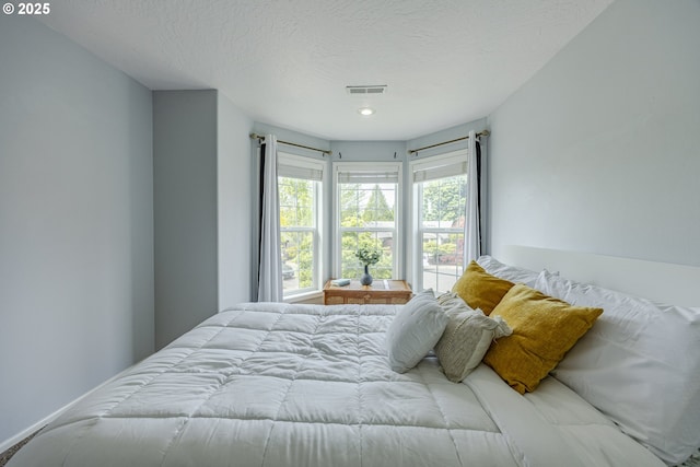 bedroom featuring a textured ceiling