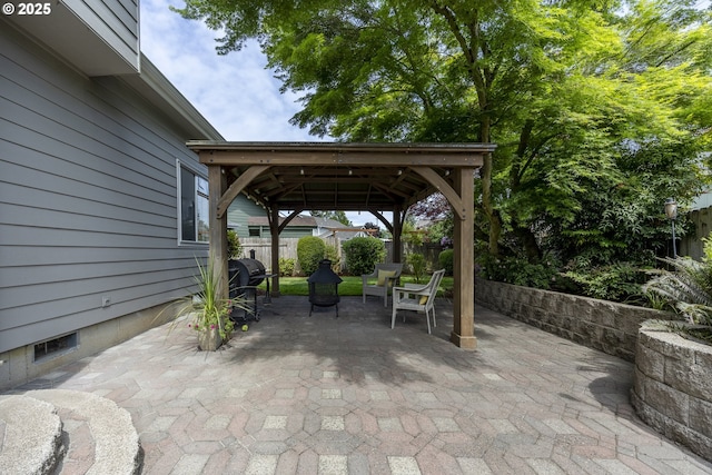 view of patio / terrace featuring a gazebo, fence, and area for grilling