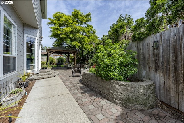 view of patio / terrace featuring a gazebo and fence