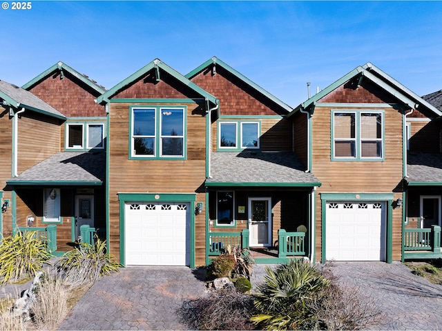 craftsman inspired home with a garage and a porch