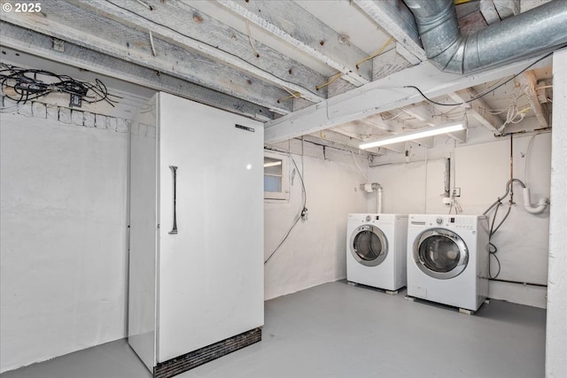 washroom with laundry area and washing machine and dryer