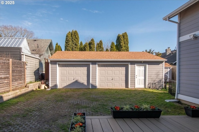 detached garage with fence