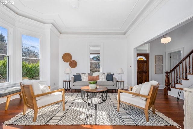 living room featuring stairway, dark wood-style floors, baseboards, and ornamental molding