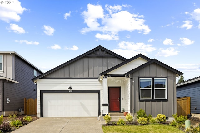 4781 Breitenbush Ave, Salem, OR 97301 - view of front of property with board and batten siding, an attached garage, and concrete driveway