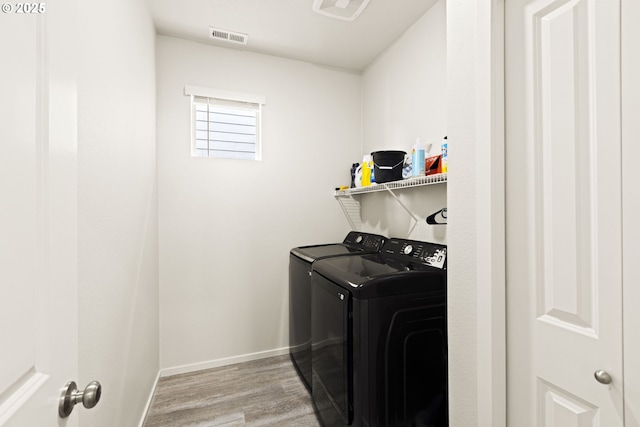 4781 Breitenbush Ave, Salem, OR 97301 - laundry area with washer and clothes dryer and wood finished floors