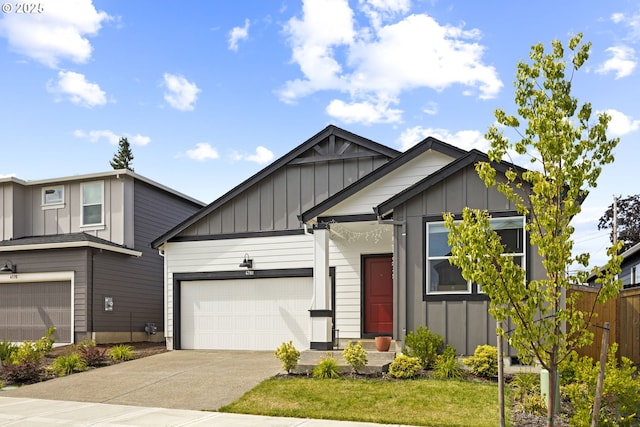 4781 Breitenbush Ave, Salem, OR 97301 - view of front of house with board and batten siding, concrete driveway, and a garage