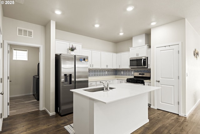4781 Breitenbush Ave, Salem, OR 97301 - kitchen with stainless steel appliances, decorative backsplash, dark wood finished floors, white cabinetry, and recessed lighting