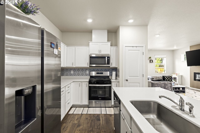 4781 Breitenbush Ave, Salem, OR 97301 - kitchen with stainless steel appliances, white cabinets, light countertops, dark wood-type flooring, and recessed lighting