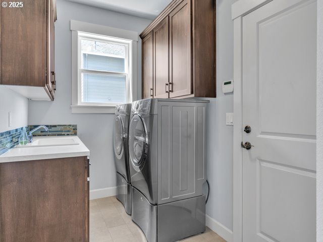 14509 SE Faircrest St, Clackamas, OR 97015 - laundry area with cabinet space and separate washer and dryer