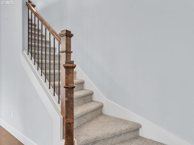 14509 SE Faircrest St, Clackamas, OR 97015 - staircase with baseboards and wood finished floors