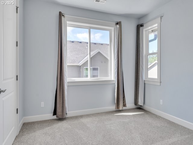 14509 SE Faircrest St, Clackamas, OR 97015 - unfurnished room featuring light colored carpet and baseboards