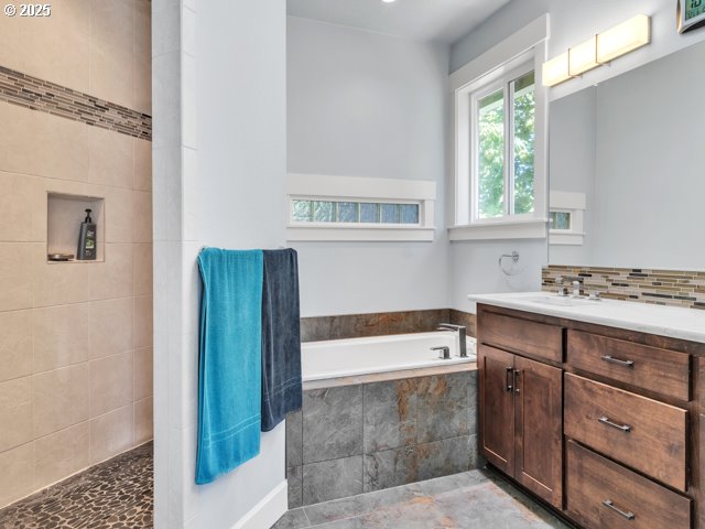 14509 SE Faircrest St, Clackamas, OR 97015 - full bath with a garden tub, vanity, tasteful backsplash, and a tile shower
