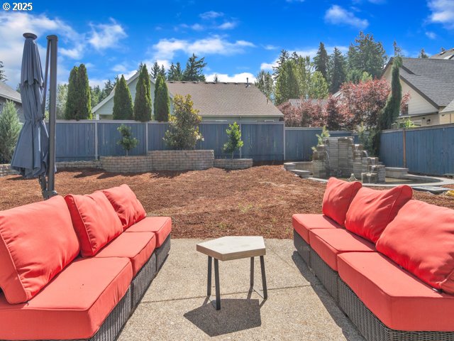 14509 SE Faircrest St, Clackamas, OR 97015 - fenced backyard featuring an outdoor living space and a patio