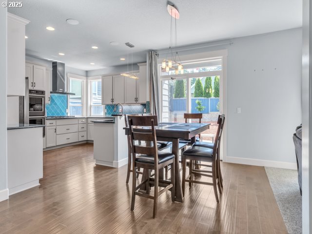 14509 SE Faircrest St, Clackamas, OR 97015 - dining area featuring recessed lighting, wood finished floors, and a chandelier