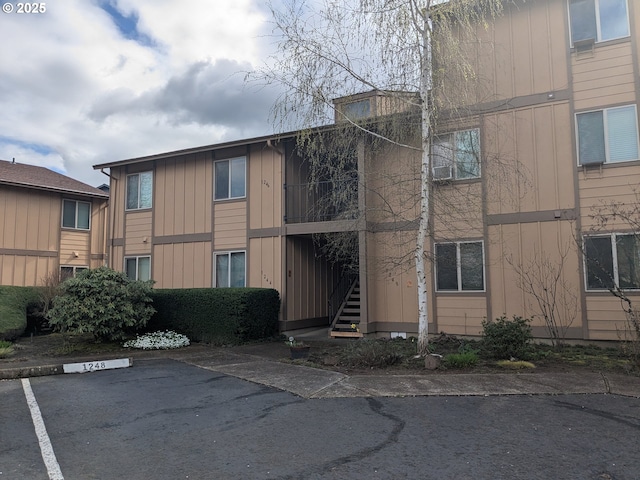 1246 NE 27th St Unit 24, Mcminnville, OR 97128 - view of property featuring uncovered parking and stairway