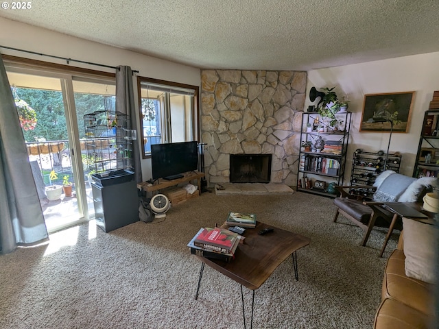 1246 NE 27th St Unit 24, Mcminnville, OR 97128 - carpeted living area with a fireplace and a textured ceiling