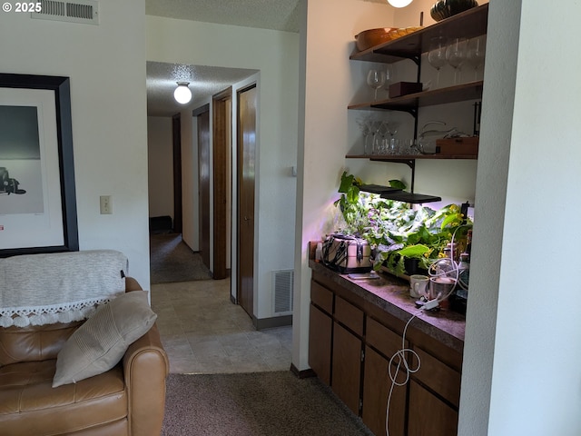1246 NE 27th St Unit 24, Mcminnville, OR 97128 - hallway featuring visible vents and a textured ceiling