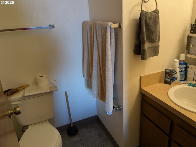 1246 NE 27th St Unit 24, Mcminnville, OR 97128 - bathroom featuring tile patterned floors, vanity, baseboards, and toilet