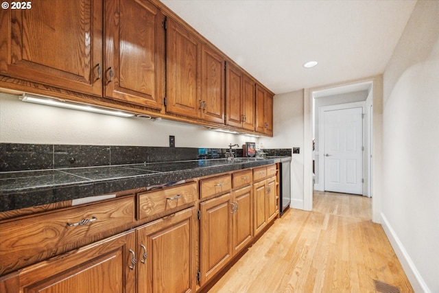 kitchen featuring sink and light wood-type flooring