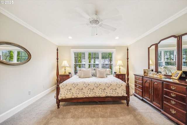 carpeted bedroom featuring ceiling fan and crown molding