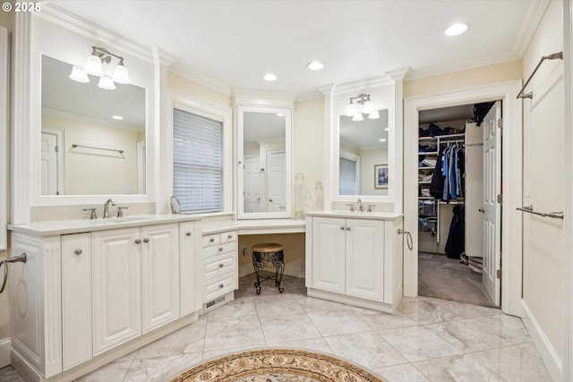 bathroom featuring vanity and ornamental molding