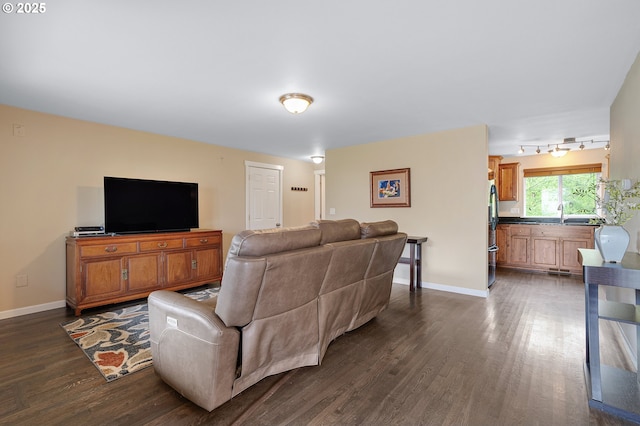 13420 SW 2nd St, Beaverton, OR 97005 - living area with dark wood-type flooring, baseboards, and rail lighting