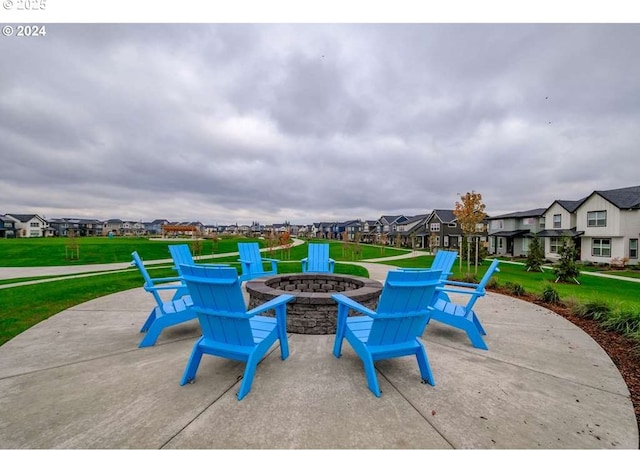 view of patio / terrace featuring a residential view and a fire pit