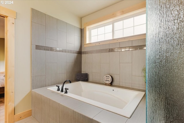 bathroom featuring tile walls and tiled tub