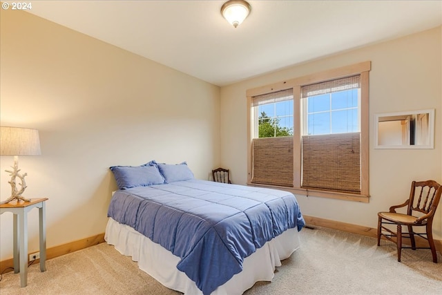 bedroom with light colored carpet