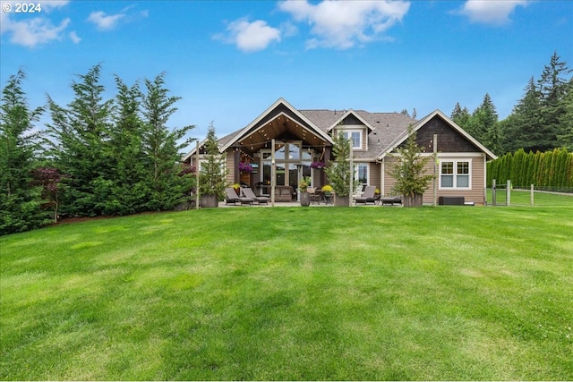 back of property featuring a yard and a patio area