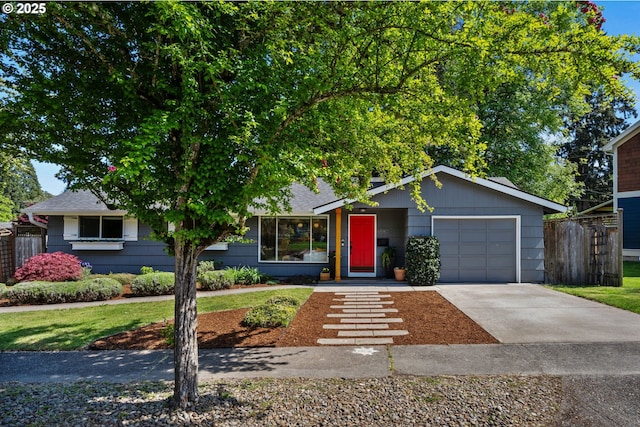 view of front of property featuring a garage, fence, driveway, and roof with shingles