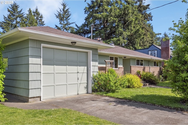 3132 SE 58th Ave, Portland, OR 97206 - view of front of home featuring an attached garage, a front lawn, driveway, and brick siding