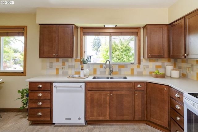 3132 SE 58th Ave, Portland, OR 97206 - kitchen with white appliances, tasteful backsplash, and light countertops