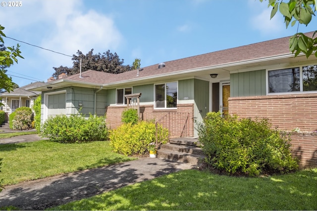 3132 SE 58th Ave, Portland, OR 97206 - single story home with brick siding, a front lawn, an attached garage, a chimney, and a shingled roof