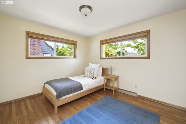 3132 SE 58th Ave, Portland, OR 97206 - bedroom with wood finished floors and a baseboard radiator