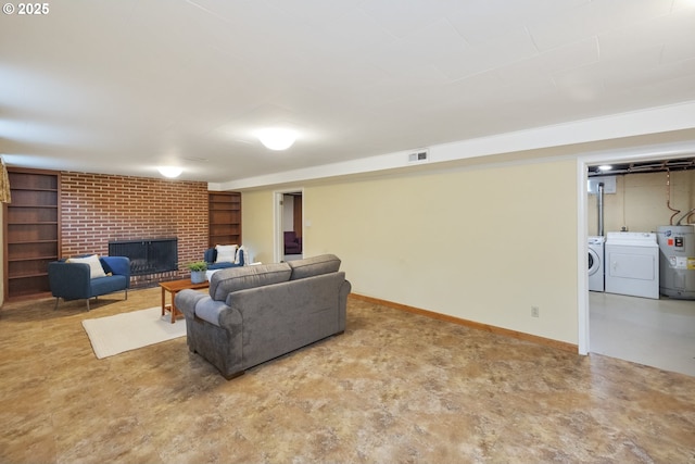 3132 SE 58th Ave, Portland, OR 97206 - living room featuring washing machine and dryer, electric water heater, a brick fireplace, and built in features