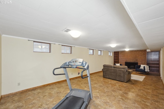 3132 SE 58th Ave, Portland, OR 97206 - exercise area featuring a brick fireplace and baseboards