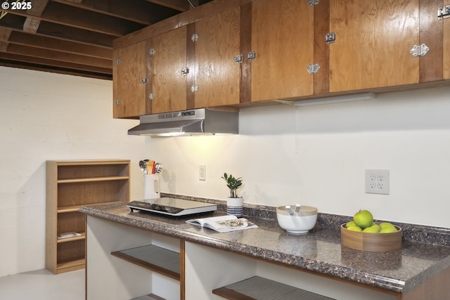 3132 SE 58th Ave, Portland, OR 97206 - kitchen featuring under cabinet range hood, brown cabinets, and dark countertops