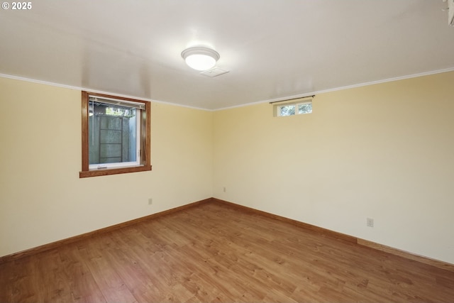 3132 SE 58th Ave, Portland, OR 97206 - spare room featuring light wood-type flooring and ornamental molding