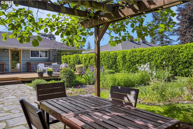 3132 SE 58th Ave, Portland, OR 97206 - wooden deck featuring outdoor dining area, a pergola, and a patio
