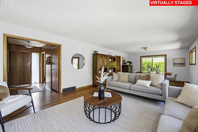 3132 SE 58th Ave, Portland, OR 97206 - living room featuring wood finished floors and baseboards