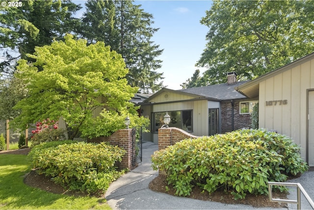 10776 SE Idleman Rd, Happy Valley, OR 97086 - property entrance with a chimney and brick siding